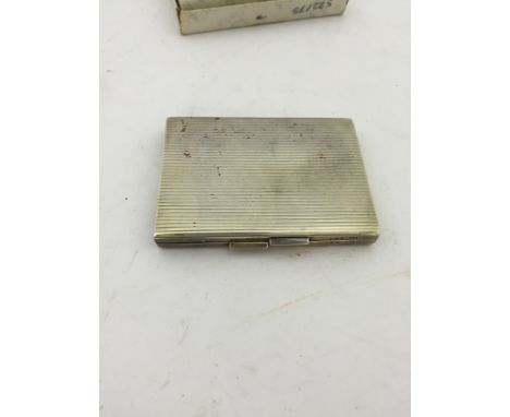 A Deco-style paste set silver compact