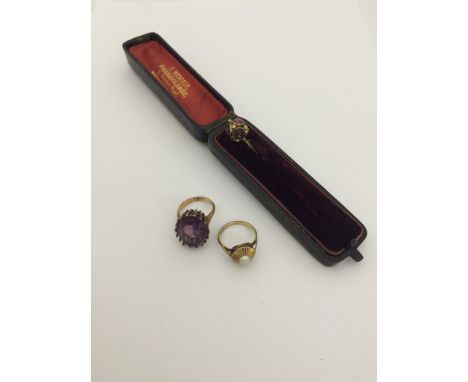 A 9ct gold mauve ring; together with a 9ct gold pearl ring and gold tie pin (cased)