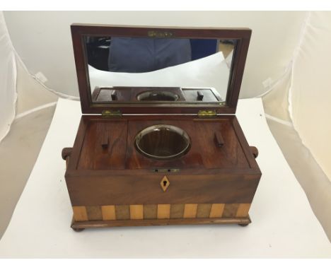 A 19th century walnut and mahogany tea caddy