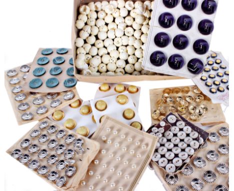 A quantity of old shop stock vintage buttons, including: pressed metal silver and gold coloured flower design examples in two