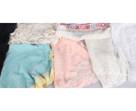 A late 19th Century black silk bodice, an early 20th Century lace blouse, a 1930s dress, a cream silk slip, silk bloomers, a 