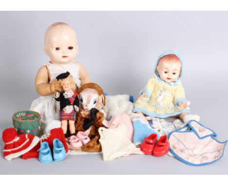 An early 1950s baby doll, two Rosebud 1960s black dolls, a hand puppet, a quantity of smaller celluloid and plastic costume d