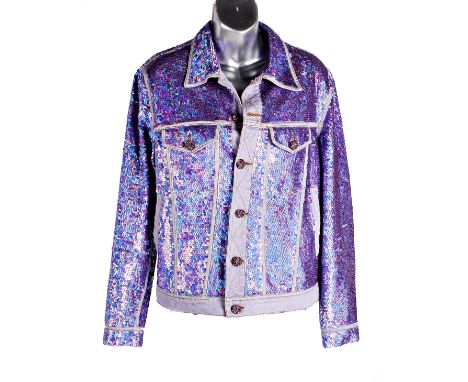 A purple cotton denim and sequin jacket from Ashish, featuring a classic collar, front button fastening with pink jewelled bu