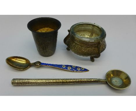 A Russian silver shot, a Norwegian silver and enamel spoon, one other white metal spoon and a salt
