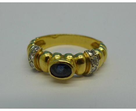 An 18ct gold, diamond and sapphire ring, 6.1g, M