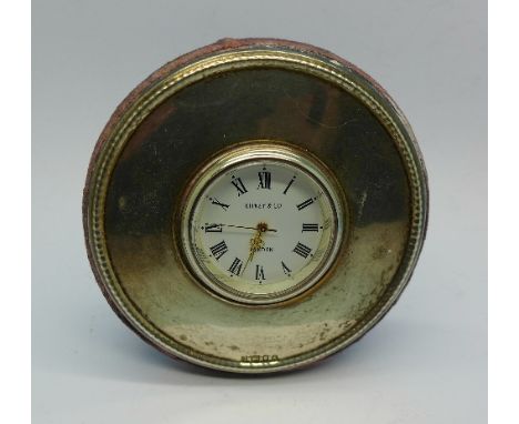 A circular silver fronted clock, 77mm