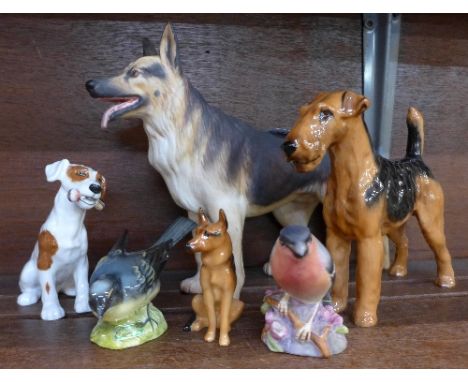 Three Royal Doulton figures of dogs, a Beswick and a Royal Worcester bird, Royal Worcester bird a/f (tail feathers)