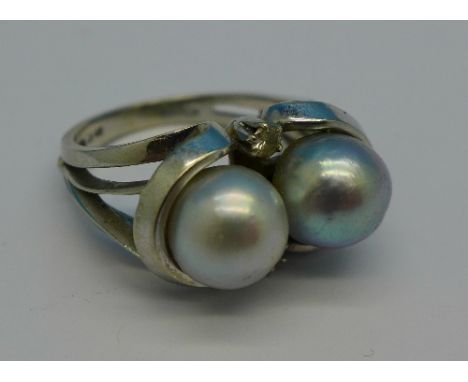 An 18ct white gold, pearl and white stone ring, 11.1g, R