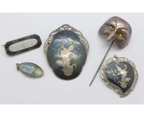 A silver butterfly wing pendant, two silver brooches, etc.