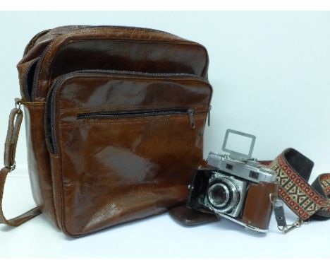 A Kodak Retina III C camera with a range finder and a camera bag