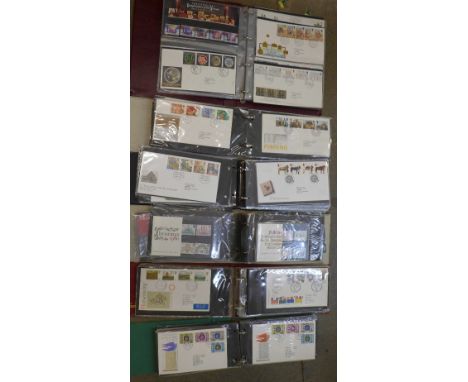 Six albums of First Day Covers and mint stamps