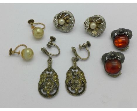 A pair of 9ct gold and pearl earrings, shell shaped pearl set earrings and two other pairs of earrings (4)