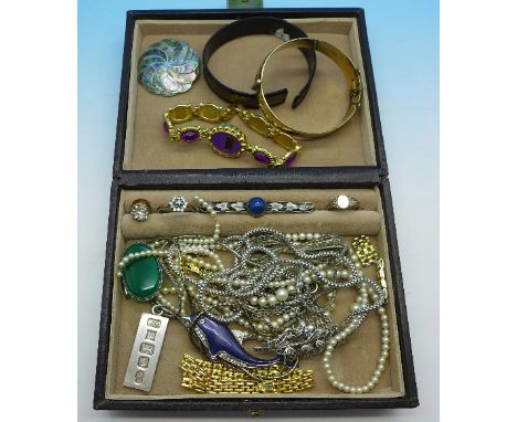 Costume jewellery; a 9ct gold metal core bangle, silver brooch, silver ingot, marcasite brooch, etc.