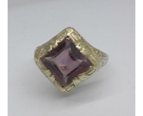 A 14k white gold and purple stone ring, 3.3g, K