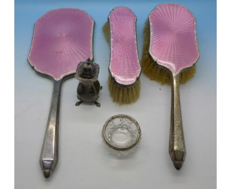 A three piece silver and pink guilloche enamel vanity set, a silver rimmed salt and a silver pepperette
