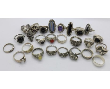 A collection of silver and white metal rings, 140g