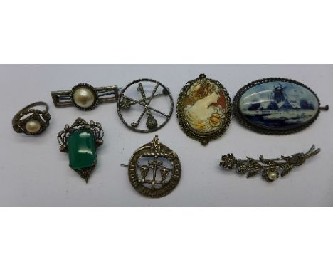 Six silver brooches, a silver and marcasite ring and a silver and green stone clip