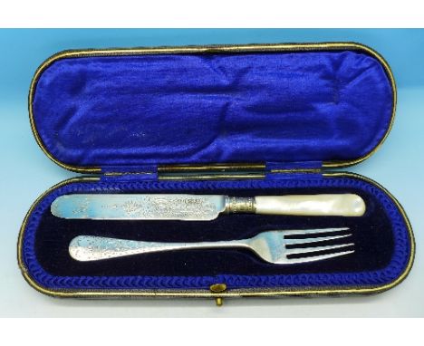 A cased silver knife and fork, Sheffield 1897 and 1900, makers WSS and JR respectively