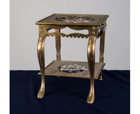 NINETEENTH CENTURY BRASS FOOTMAN, of typical form with stylised floral pierced centres to the top and undertier, and cabriole