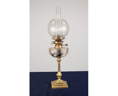 BRASS OIL TABLE LAMP, of slender, panelled baluster form with square, stepped base, cut glass reservoir, frosted glass shade,