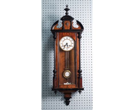 TWENTIETH CENTURY WALNUT AND EBONISED VIENNA STYLE WALL CLOCK WITH SPRING DRIVEN MOVEMENT, the two part 5 ½? enamelled Roman 