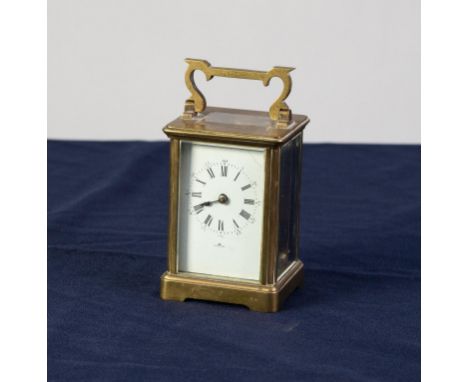'KINGS COURT', TWENTIETH CENTURY BRASS CARRIAGE CLOCK, of typical form with white Roman dial and corniche type case with oblo