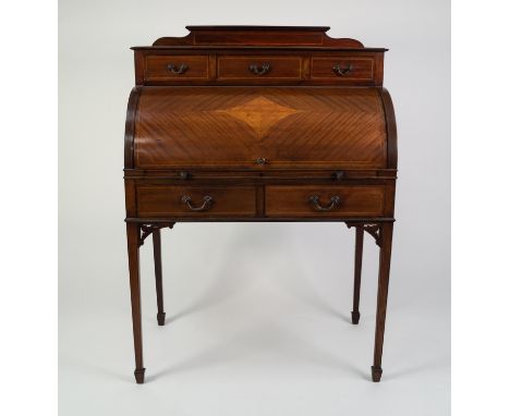EDWARDIAN LINE INLAID AND FIGURED MAHOGANY CYLINDER BUREAU, the moulded oblong top with short back, set above three short dra