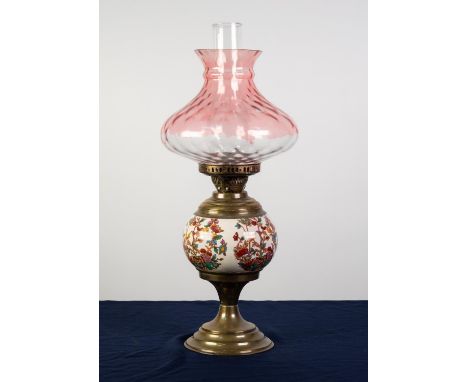 LATE VICTORIAN BRASS TABLE OIL LAMP WITH POTTERY GLOBULAR RESERVOIR, printed with oriental style flowering shrubs, pink stain