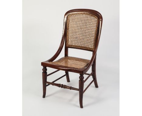 LATE VICTORIAN MAHOGANY STAINED FRUITWOOD NURSING CHAIR, the moulded show wood frame with downswept arms enclosing a bow fron