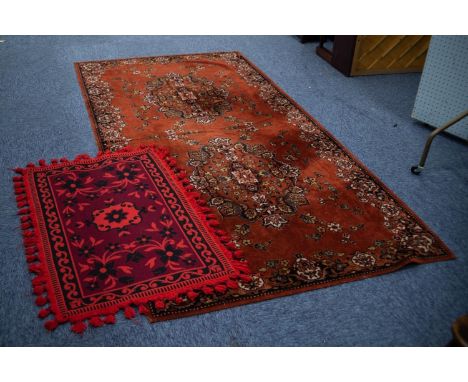 BELGIUM MACHINE WOVEN TAPESTRY SMALL CARPET OF PERSIAN STYLE, with two large oval floral medallions on a brick red field with