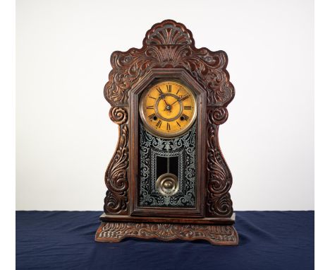 ANSONIA CLOCK CO., NEW YORK, USA, LATE 19th/EARLY 20th CENTURY SHELF CLOCK, with typical stained wood case, having foliate sc