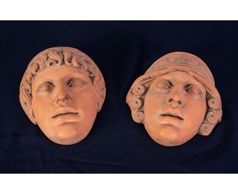 PAIR OF HEAVY TERRA COTTA CLASSICAL MALE AND FEMALE WALL MASKS, 9 1/2in (24cm) high, with raised signature R. Luza verso (2) 