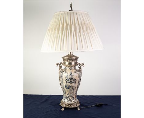 ELABORATE BLUE AND WHITE DELFT VASE SHAPE TABLE LAMP painted with chinoiserie pagodas, plated metal top issuing scroll handle