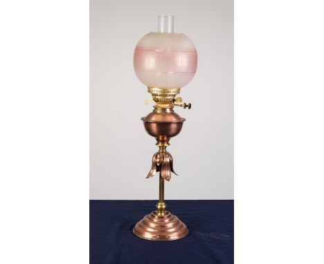 STYLISH COPPER AND BRASS OIL TABLE LAMP, of slender column form with leaf pattern collar, moulded circular base, copper reser