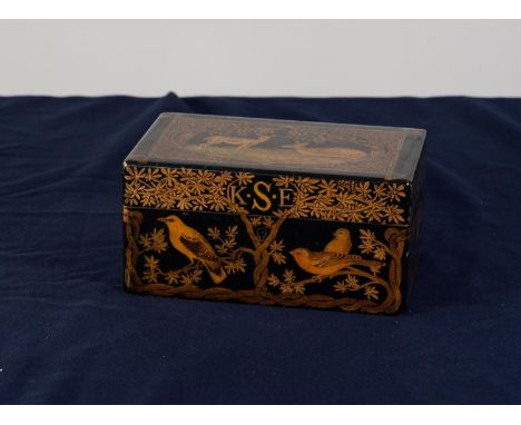 EARLY TWENTIETH CENTURY BLACK LACQUERED AND PENWORK DECORATED JEWELLERY BOX, of typical form the exterior well decorated with