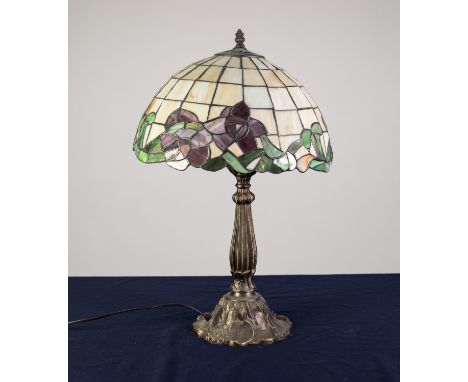 MODERN TIFFANY STYLE BRONZED COMPOSITION ELECTRIC TABLE LAMP AND SHADE, of typical form with leaded effect domed shade, 24? (