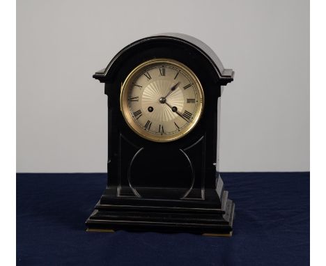 AN EARLY TWENTIETH CENTURY BLACK SLATE CASED MANTEL CLOCK, the 'Foreign Make' stamped movement striking on a gong with silver