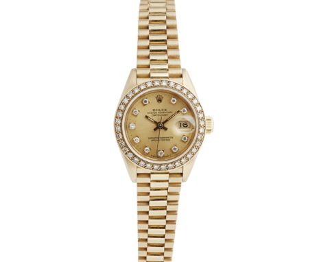 An 18ct gold and diamond set lady's wrist watch, RolexOyster Perpetual Datejust, ref. 69718, champagne dial, sweep second han