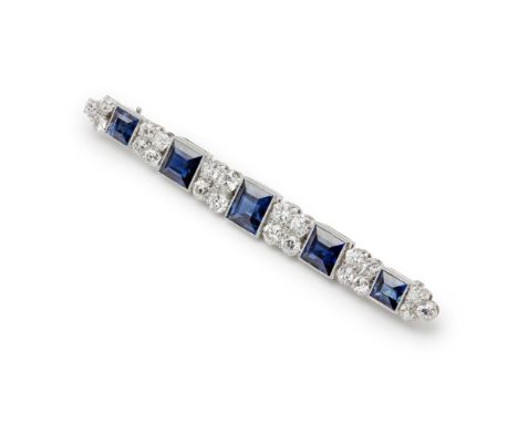 A sapphire and diamond set bar broochclaw set with five graduated square cut sapphires, between graduated clusters of four or