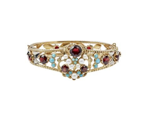 A 1960s multi-gem set bangleof openwork hinged design, set throughout with pearls, round mixed cut garnets and turquoise cabo