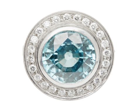 A zircon and diamond cluster ringcollet set with a round mixed cut blue zircon, in a single border of round brilliant cut dia