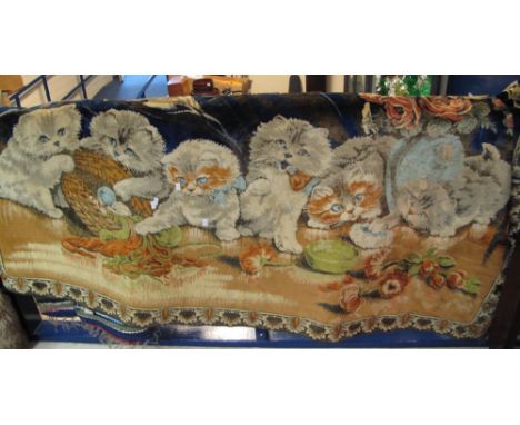 Machine woven wall hanging with a design of kittens playing. 