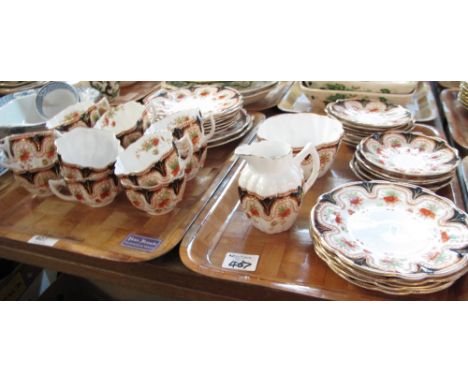 Two trays of Melba bone china part teaware items on a white ground with gilt and floral decoration comprising teacups, saucer