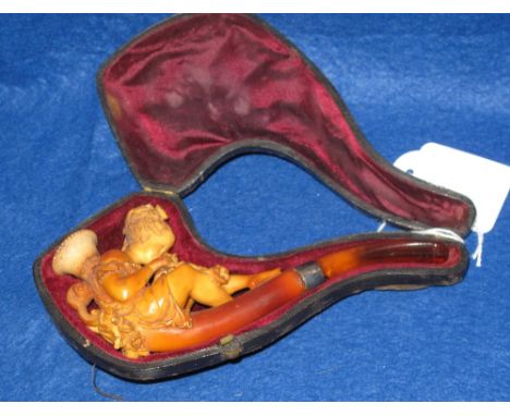 Figural Meerschaum pipe with amber stem in fitted case. CONDITION REPORT: Case generally worn. Amber stem broken. Mouth of pi