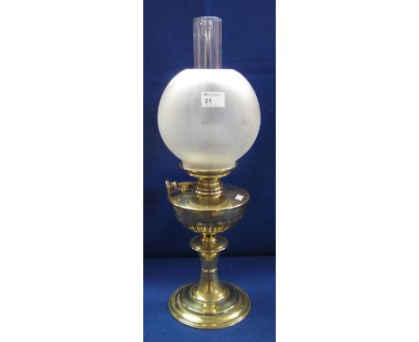 Early 20th Century brass oil lamp with fluted half lobed reservoir, pedestal base, frosted shade and clear chimney. 