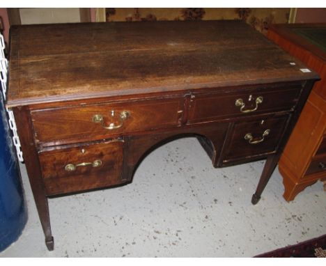 19th Century mahogany inlaid knee hole desk with an arrangement of drawers on square tapering legs and spade feet.