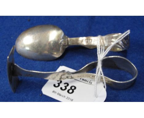 Silver caddy spoon and a silver child's 'pusher'. (2)