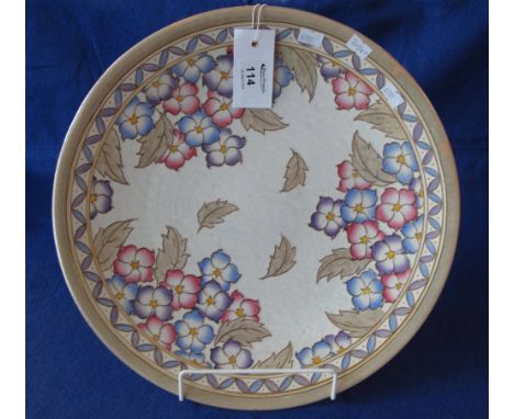 Bursley ware Charlotte Rhead design pottery charger with overall tube lined floral decoration.  Printed marks. CONDITION REPO