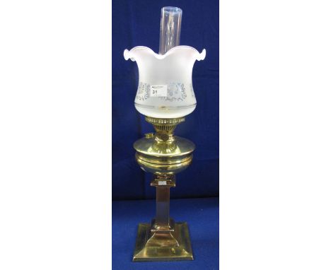 Brass double burner oil lamp with baluster reservoir on square section pedestal base, with frosted glass shade and clear chim