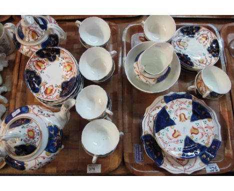 Two trays of 19th Century Gaudy Welsh tulip design teaware to include teacup, saucers, milk jug, sucrier, teapot, plates etc.